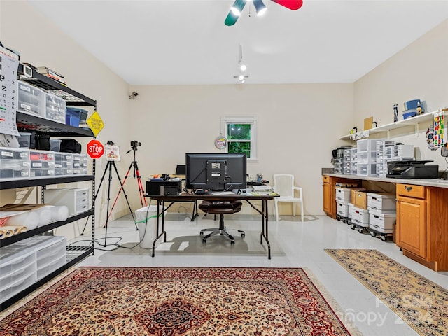 tiled office space featuring ceiling fan