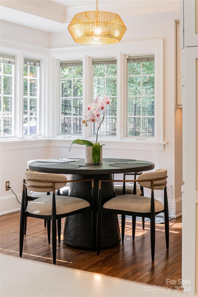 sunroom / solarium with an inviting chandelier