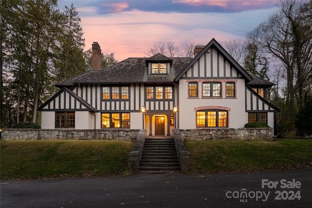 tudor house with a lawn