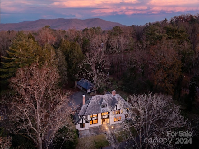 aerial view at dusk with a mountain view