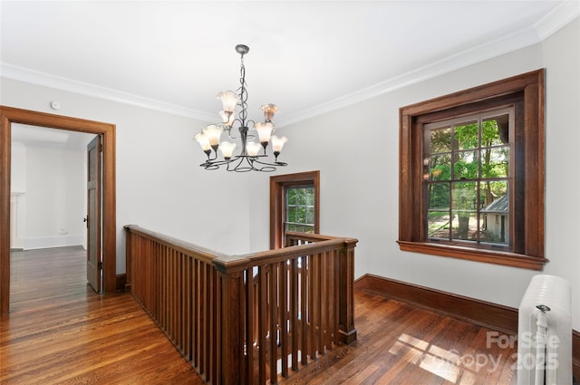 30 Cedarcliff Rd, Asheville, NC 28803 - corridor featuring crown molding, a chandelier, an upstairs landing, healthy amount of natural light, and wood finished floors