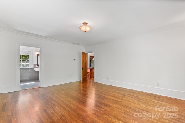 30 Cedarcliff Rd, Asheville, NC 28803 - empty room with hardwood / wood-style flooring, ornamental molding, and baseboards