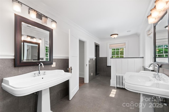 30 Cedarcliff Rd, Asheville, NC 28803 - bathroom featuring tile walls, radiator, wainscoting, tile patterned floors, and crown molding