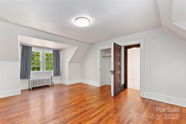 30 Cedarcliff Rd, Asheville, NC 28803 - bonus room with radiator, vaulted ceiling, wood finished floors, and baseboards