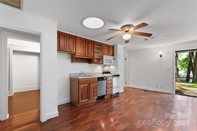 30 Cedarcliff Rd, Asheville, NC 28803 - kitchen with dishwasher, white microwave, brown cabinetry, and ceiling fan