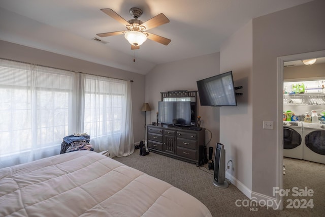 bedroom featuring ceiling fan, separate washer and dryer, multiple windows, and carpet floors