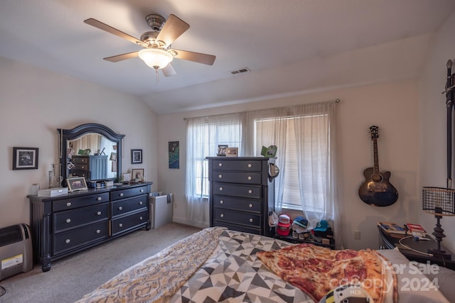 bedroom featuring light carpet, lofted ceiling, and ceiling fan