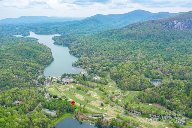 aerial view featuring a water and mountain view