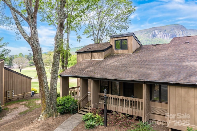 exterior space featuring a mountain view and covered porch