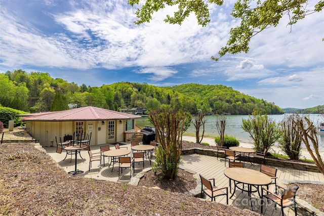 view of patio featuring a water view