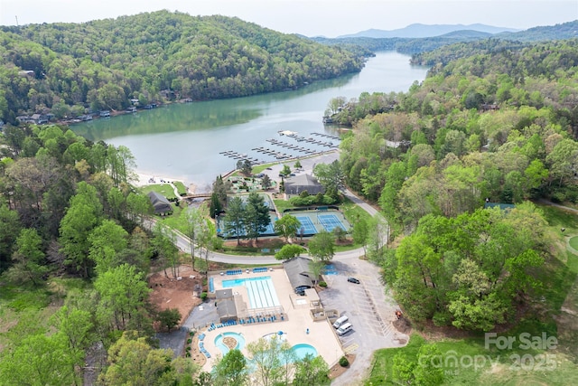 aerial view featuring a water and mountain view