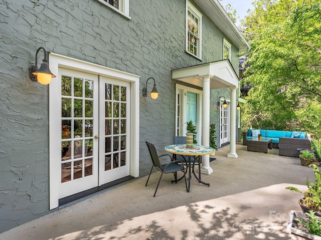 view of patio with outdoor lounge area and french doors