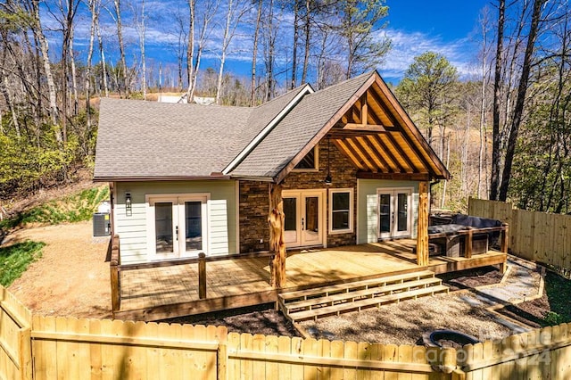 view of front of home with french doors and a deck