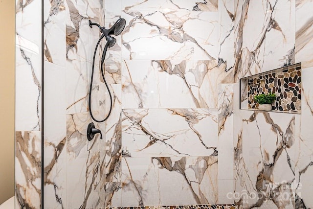 details featuring a tile shower