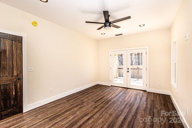 empty room featuring french doors, ceiling fan, and dark hardwood / wood-style floors