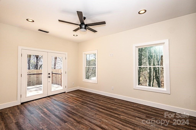 unfurnished room with french doors, dark wood-type flooring, and ceiling fan