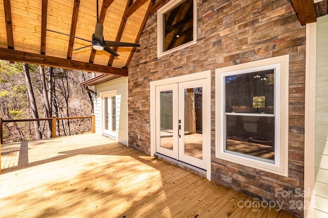 deck with french doors and ceiling fan