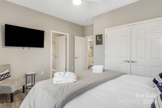 bedroom with hardwood / wood-style floors, a closet, and ceiling fan