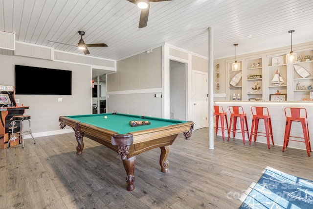 recreation room featuring ornamental molding, ceiling fan, billiards, hardwood / wood-style floors, and bar