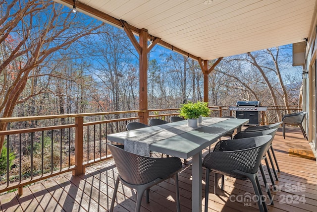 wooden deck featuring grilling area