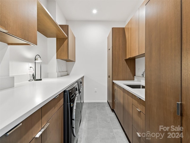 kitchen with sink and light tile flooring