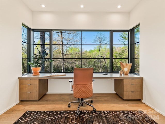 office area with plenty of natural light and light wood-type flooring