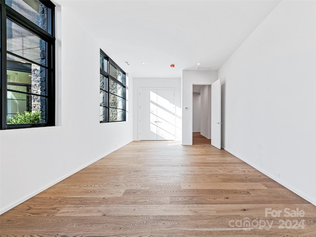 unfurnished room featuring light hardwood / wood-style floors