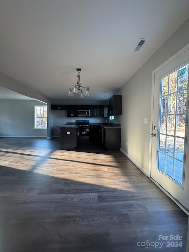 kitchen featuring sink, plenty of natural light, dark hardwood / wood-style floors, and black range with electric cooktop