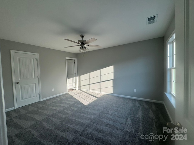 carpeted empty room with ceiling fan