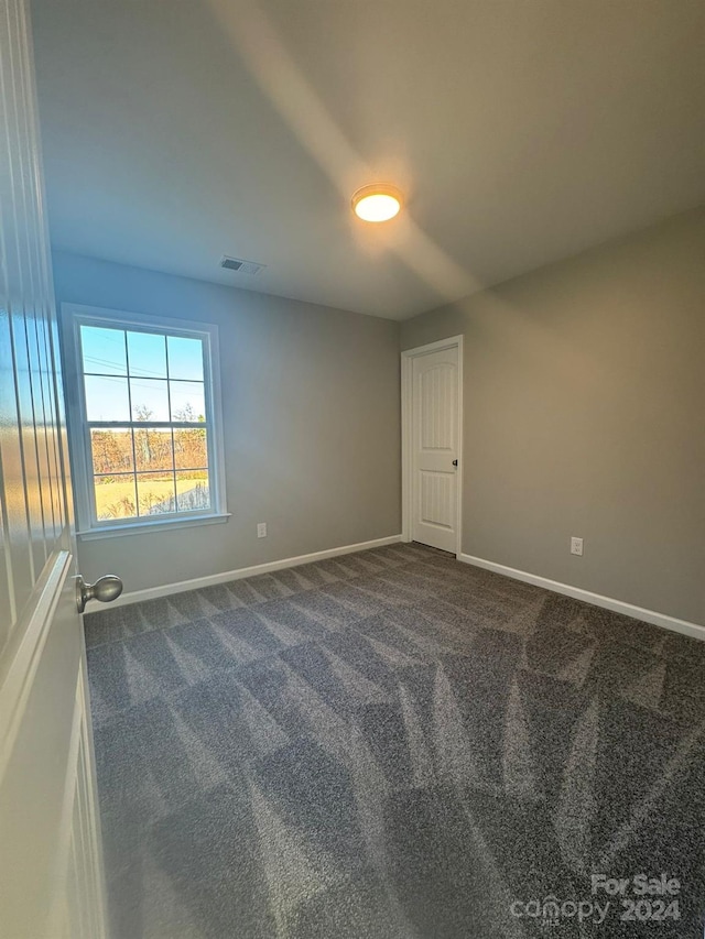 empty room featuring carpet flooring