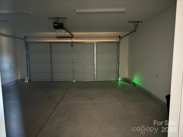 garage featuring a garage door opener