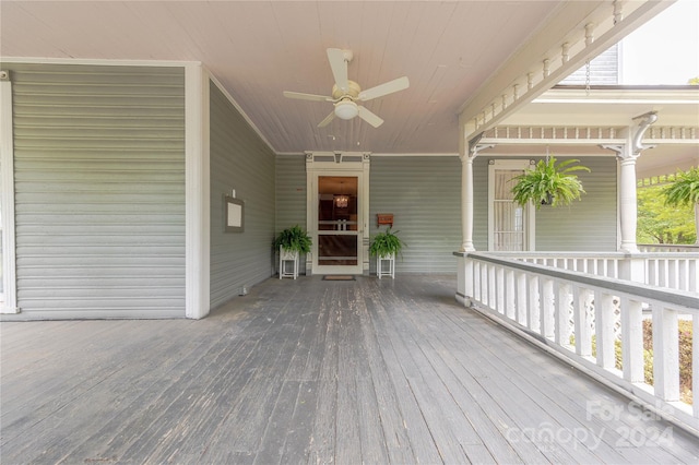 deck featuring covered porch and ceiling fan