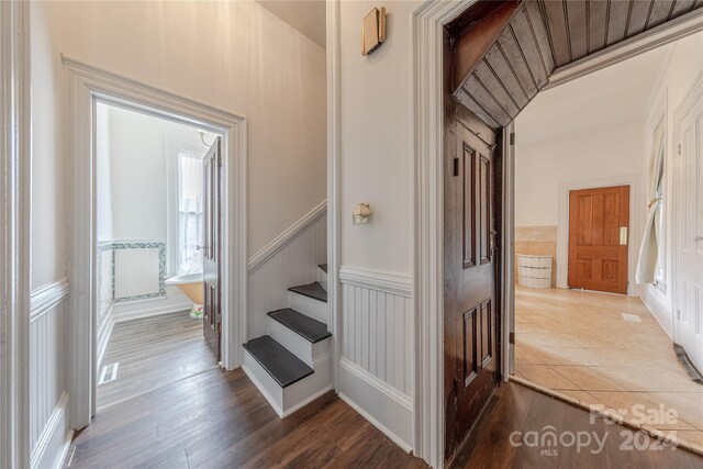 stairs with wood-type flooring