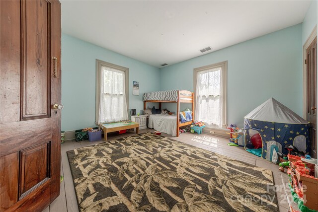 bedroom featuring multiple windows