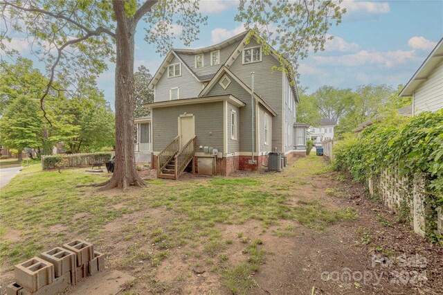 back of property featuring cooling unit