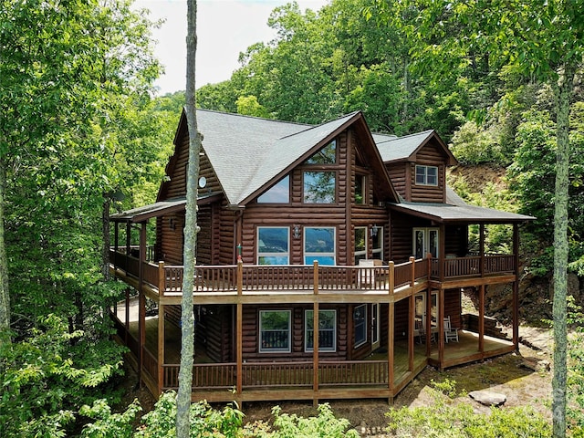 back of house featuring a wooden deck