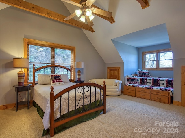 carpeted bedroom featuring lofted ceiling and ceiling fan