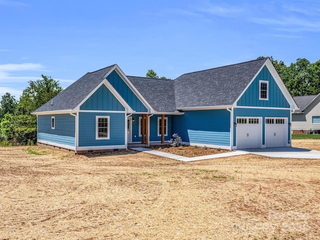 craftsman inspired home featuring covered porch and a garage