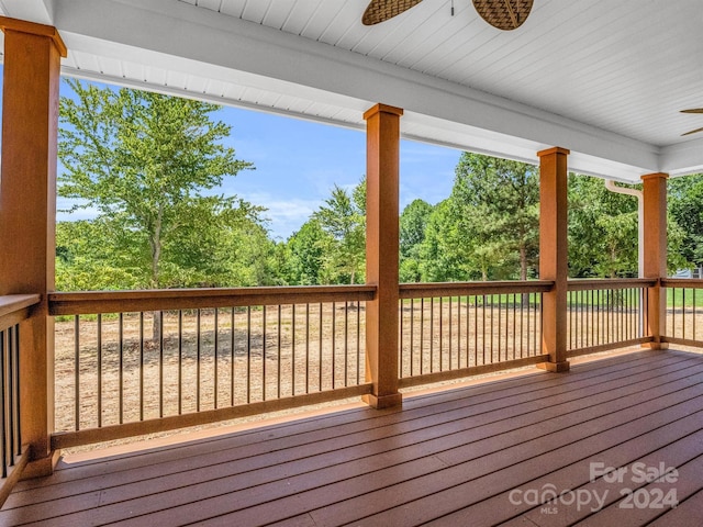 wooden deck with ceiling fan