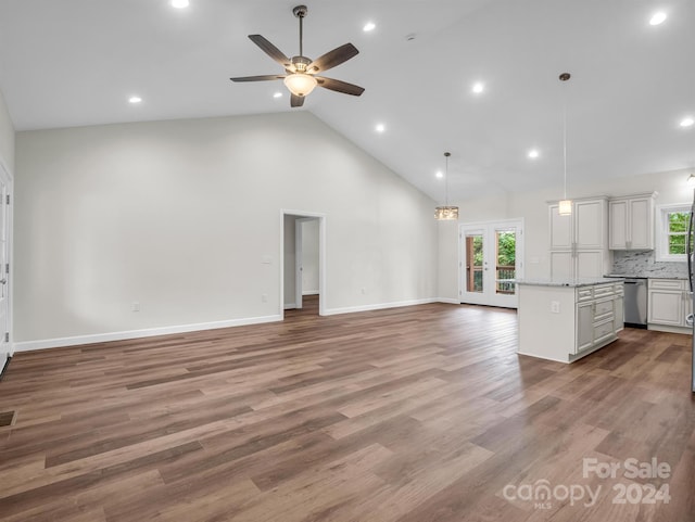 unfurnished living room featuring french doors, ceiling fan, light hardwood / wood-style flooring, and high vaulted ceiling