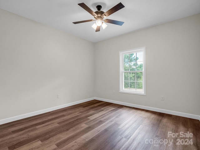 empty room featuring ceiling fan and wood-type flooring