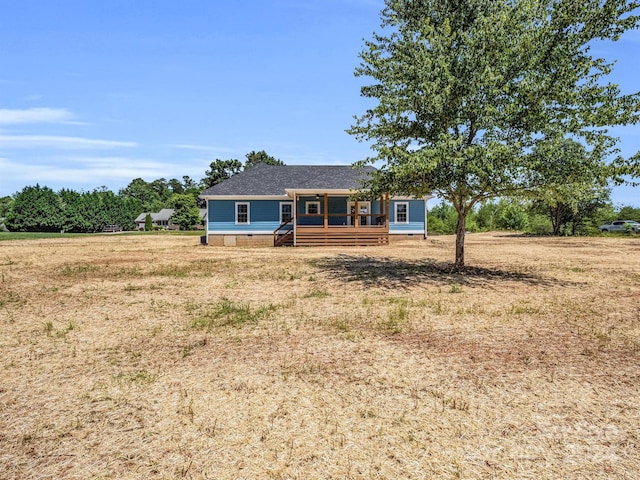 single story home with a porch and a front yard