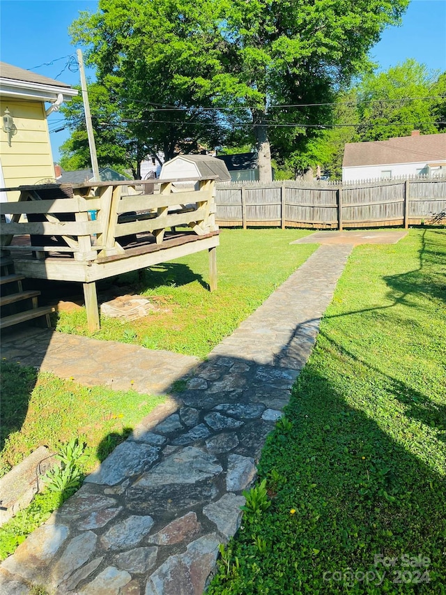 view of yard featuring a wooden deck