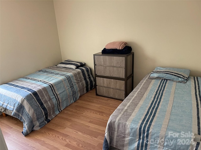 bedroom with light hardwood / wood-style floors