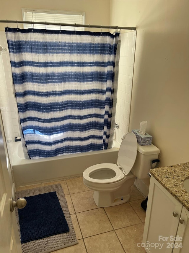 full bathroom with shower / bath combo with shower curtain, vanity, toilet, and tile flooring