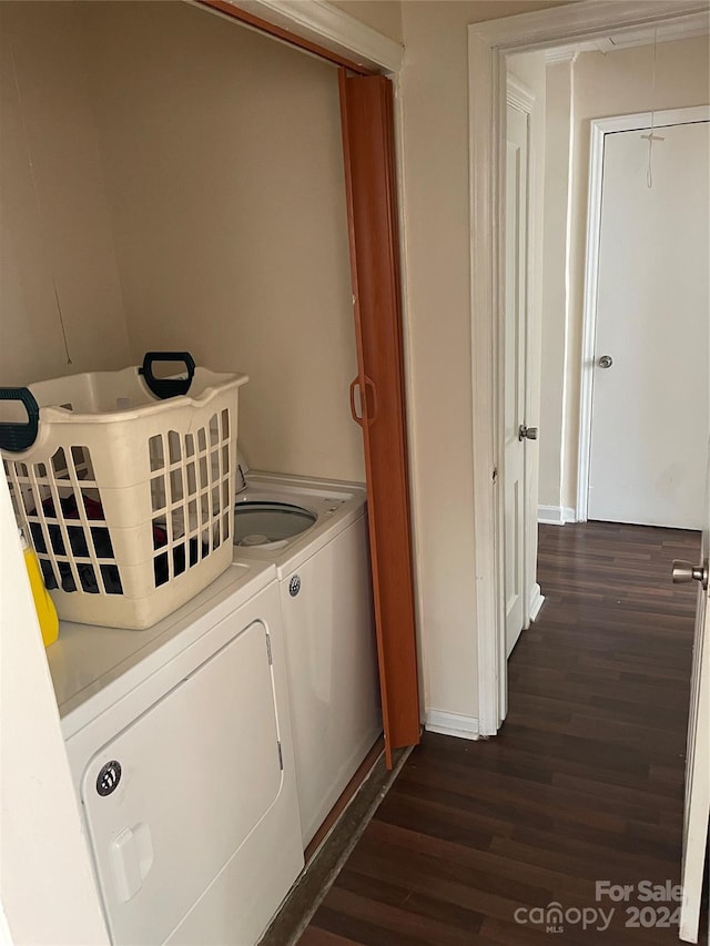 laundry room with dark hardwood / wood-style flooring and washer and clothes dryer