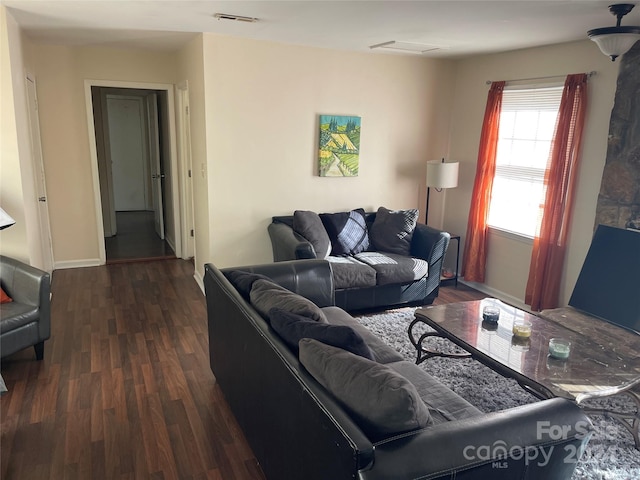 living room featuring dark hardwood / wood-style floors