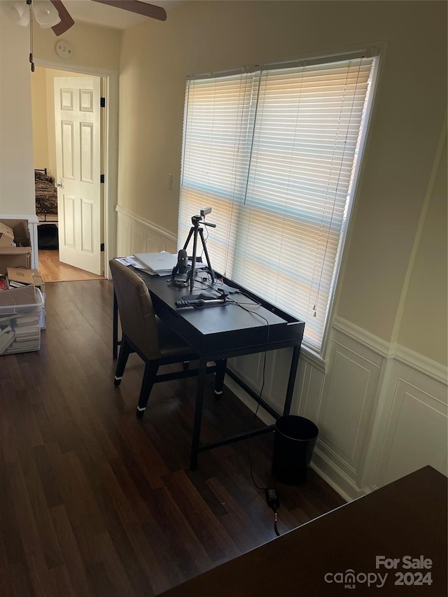 dining space with hardwood / wood-style floors and ceiling fan