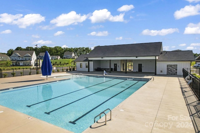 view of swimming pool featuring a patio area