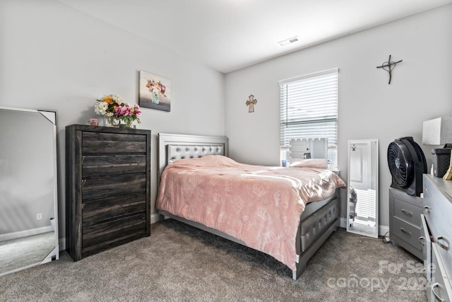 bedroom featuring carpet